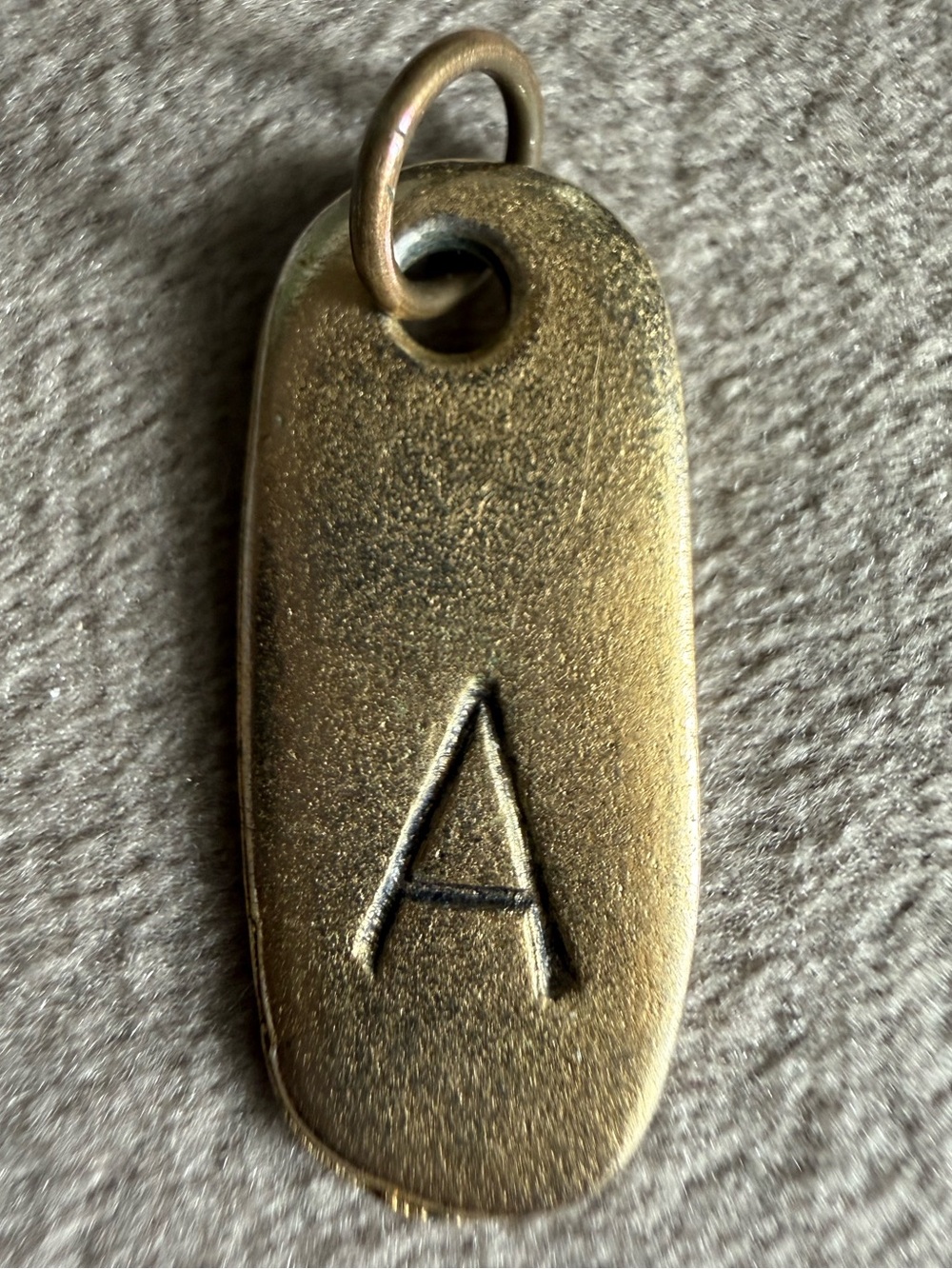 Jewel Kade Gold Brass-tone Oval Pendant Tag
